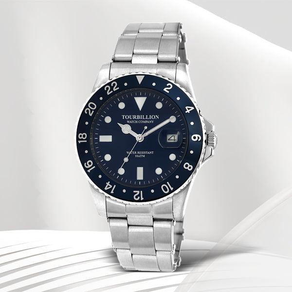 TOURBILLION WATCH COMPANY VINTAGE COLLECTION WATCH SILVER CASE BLUE DIAL WITH INDEX AND BLUE ALUMINUM BEZEL WITH STAINLESS STEEL EXPANDABLE STRAP
